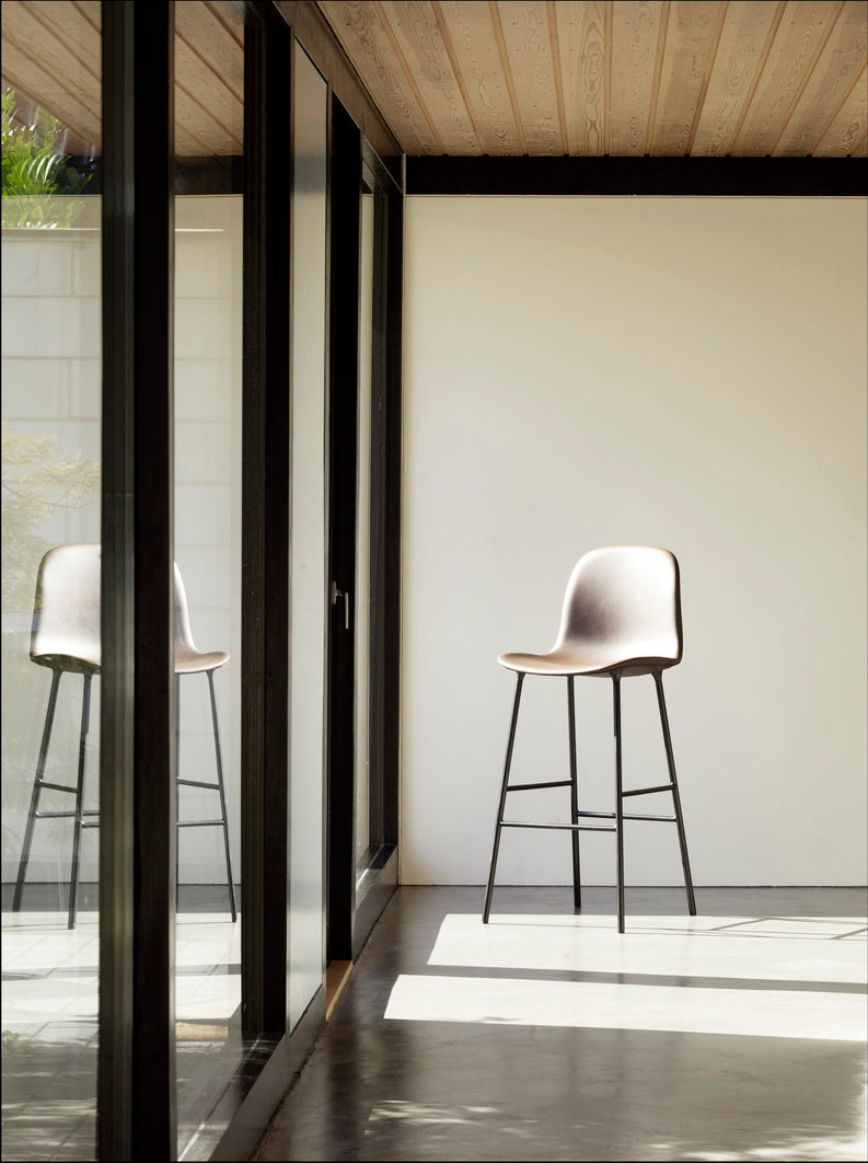 Bar chair upholstered forms with a brown base