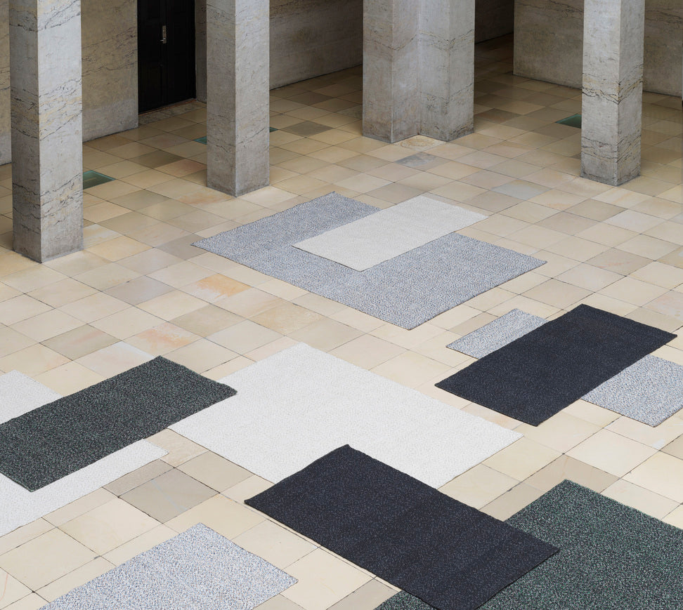 The rug is dark gray