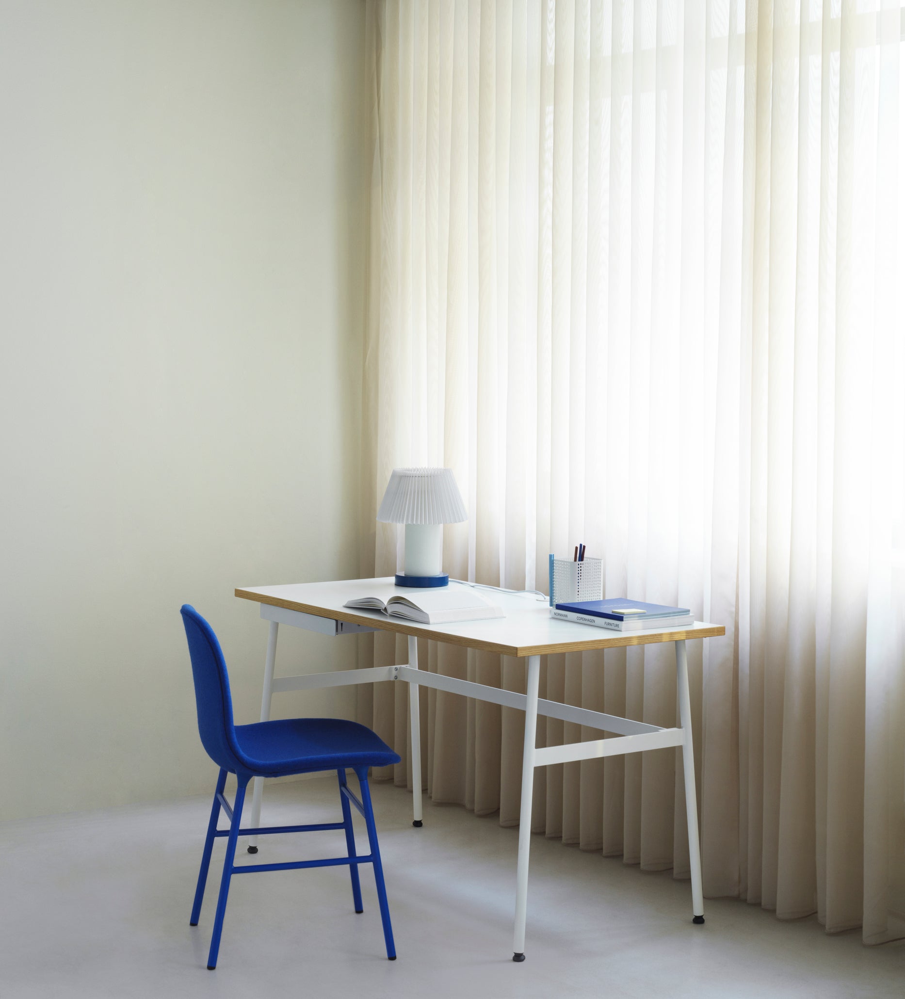 Upholstered chair forms with a golden base