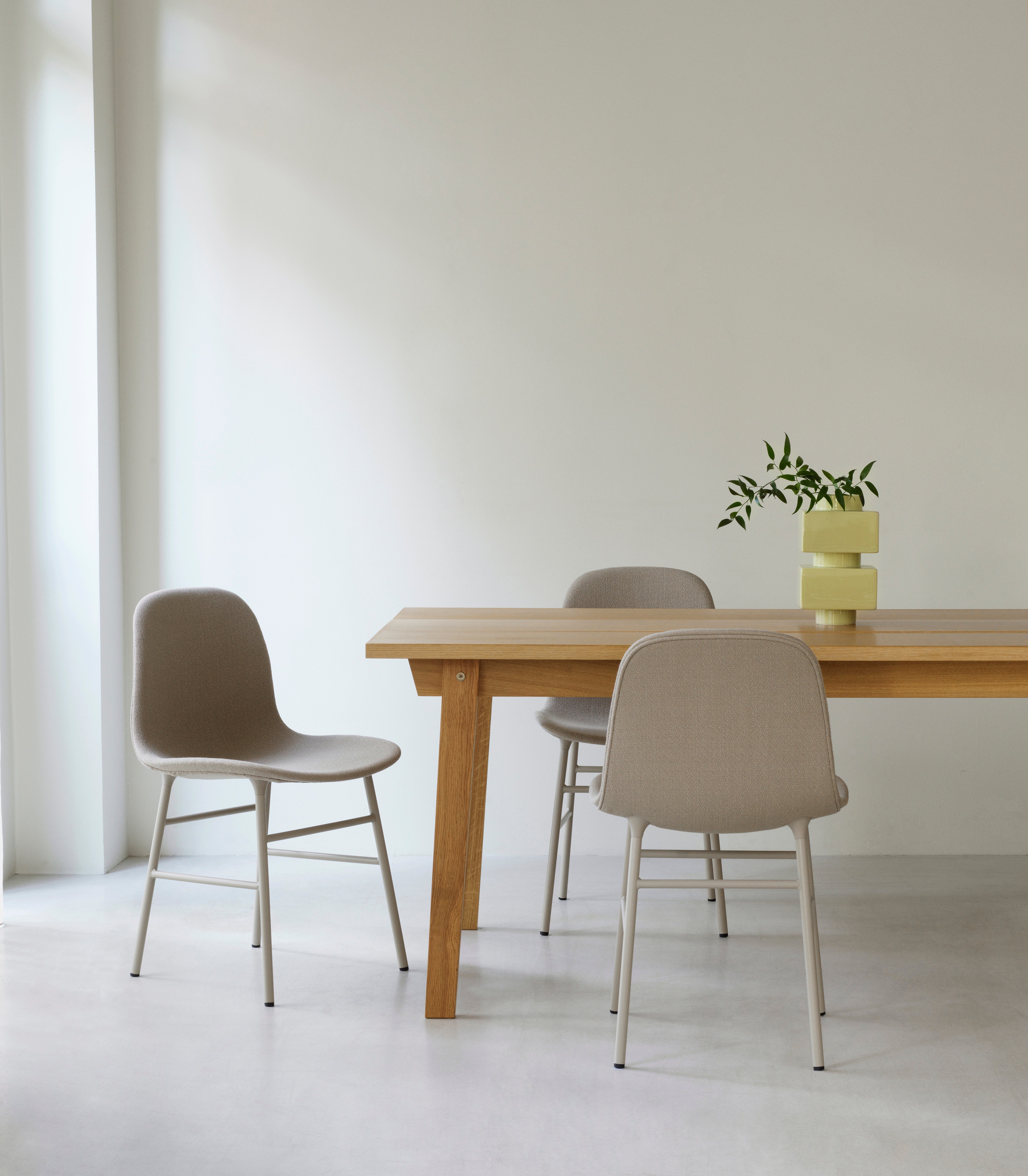 Upholstered chair forms with a golden base