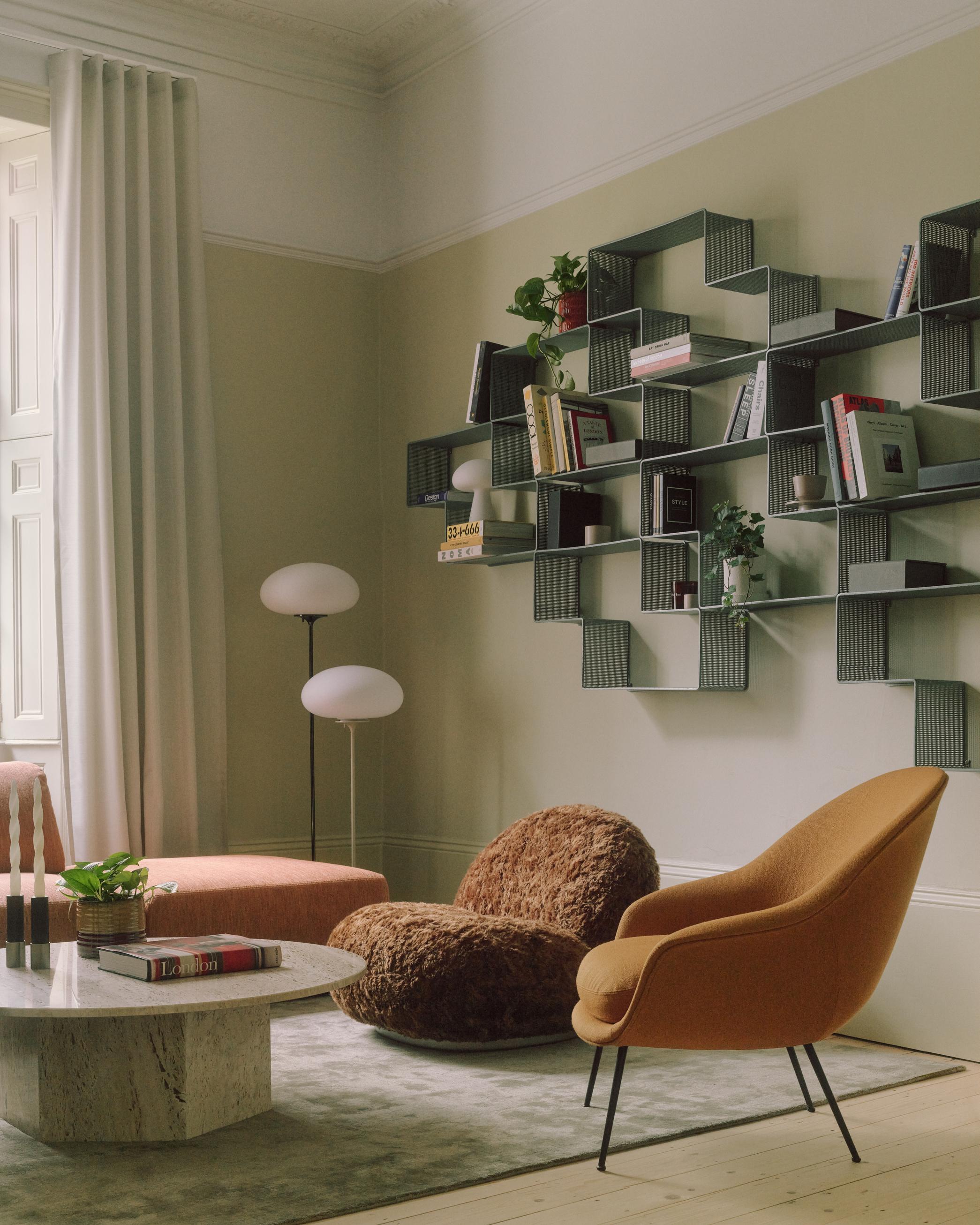 Upholstered BAT armchair with black base