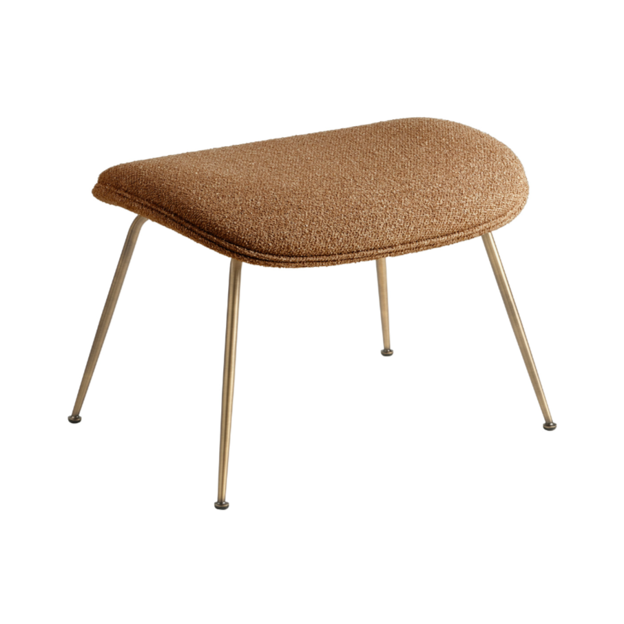 BEETLE pouf upholstered with a brass base