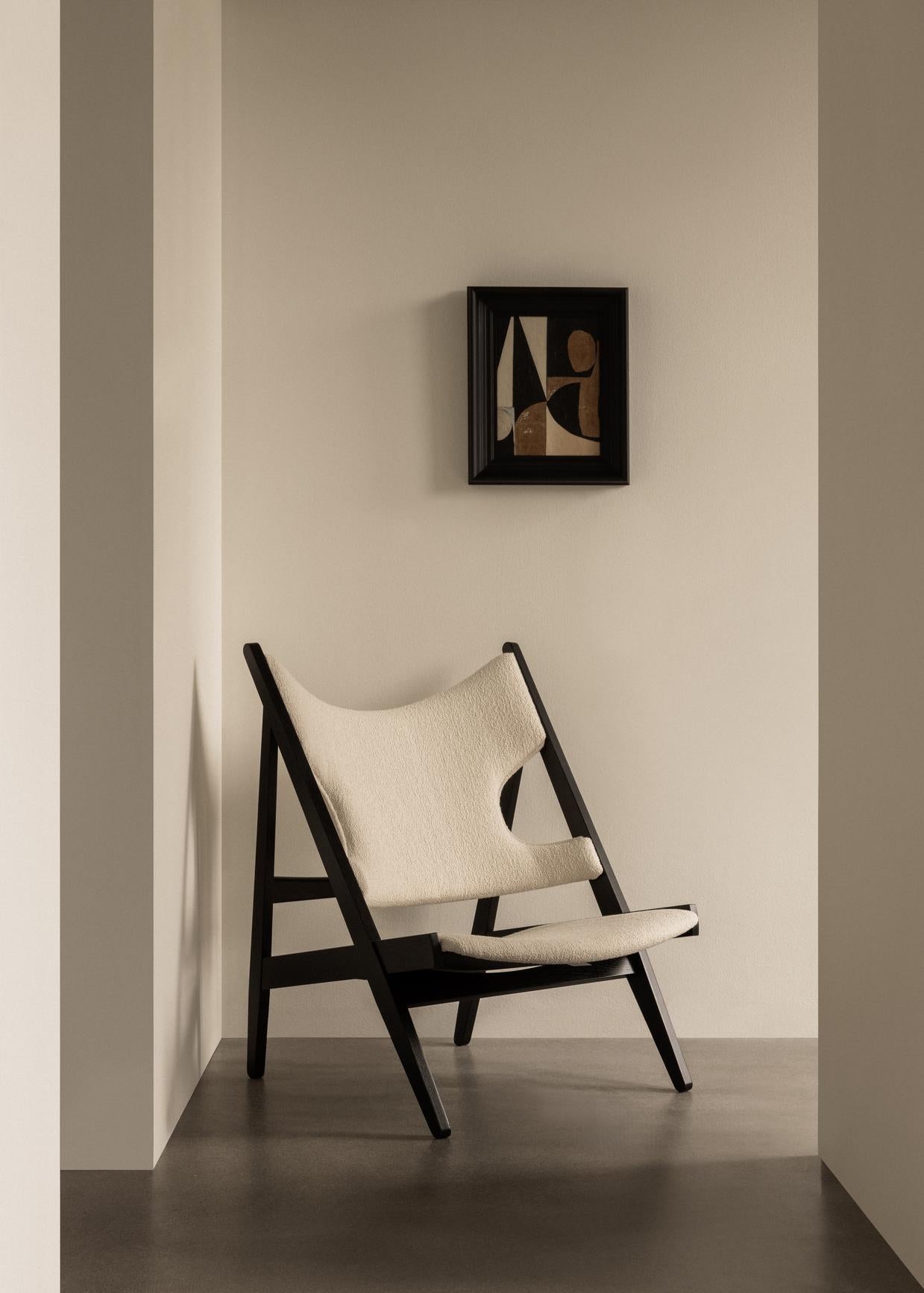 KNITTING cream armchair with walnut base