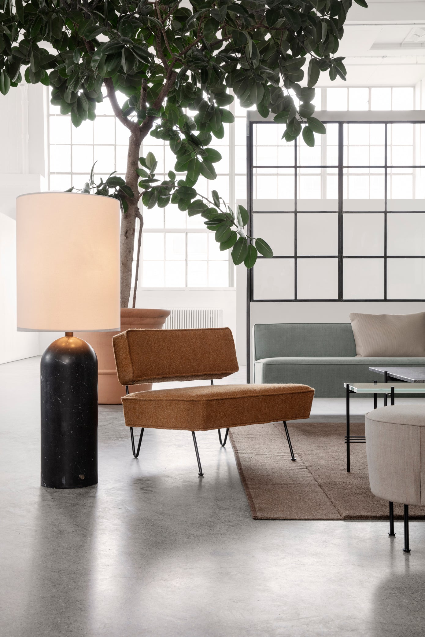 MODERN LINE pouf upholstered with a gold base