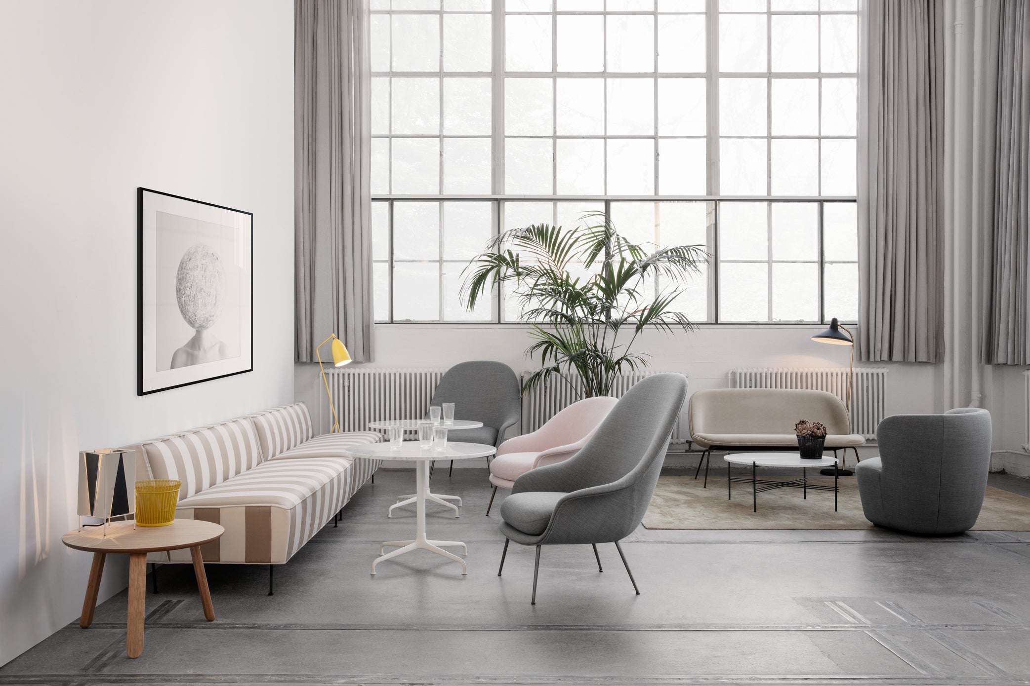 Upholstered BAT armchair with black base