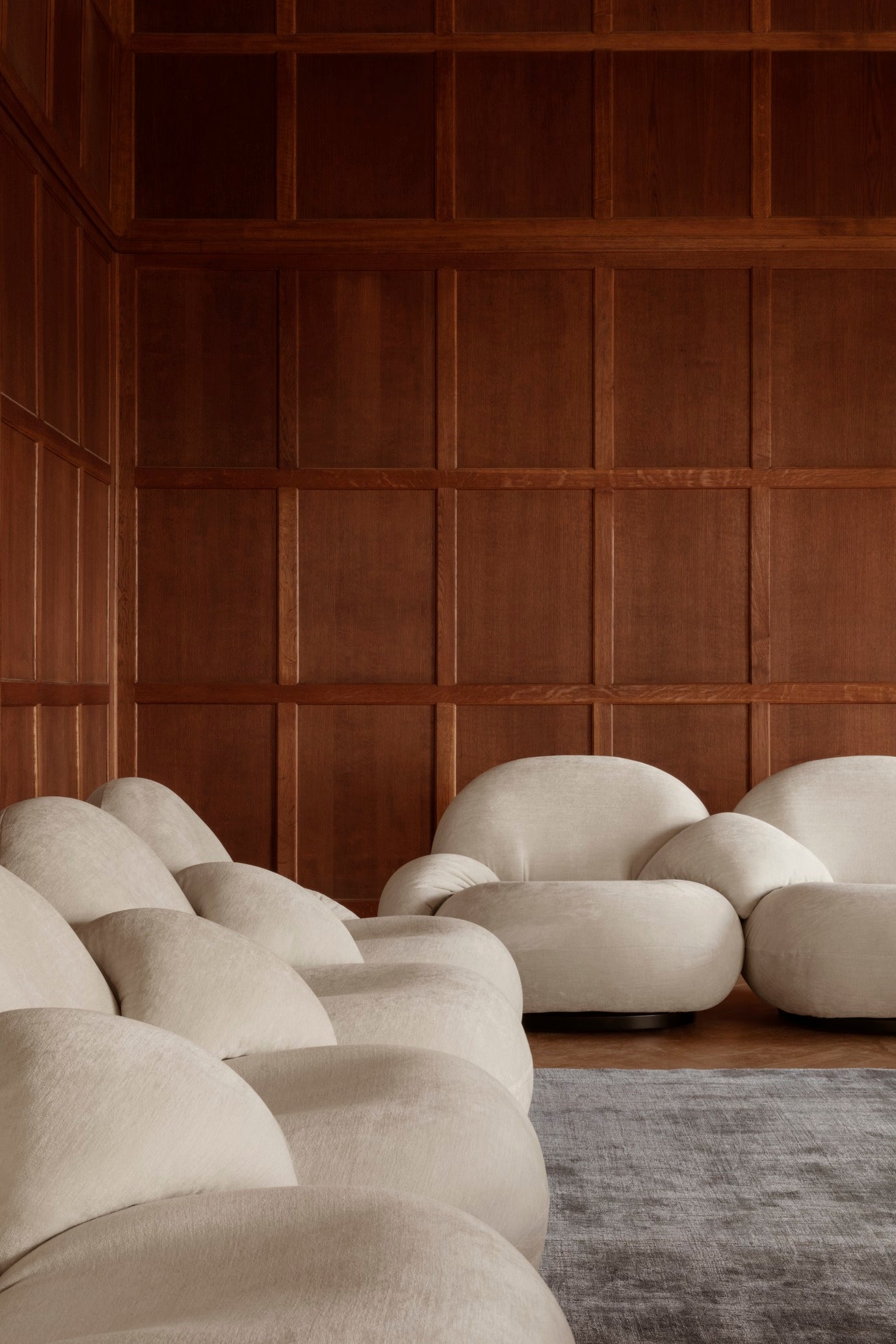 2-seater PACHA sofa upholstered with a gold base