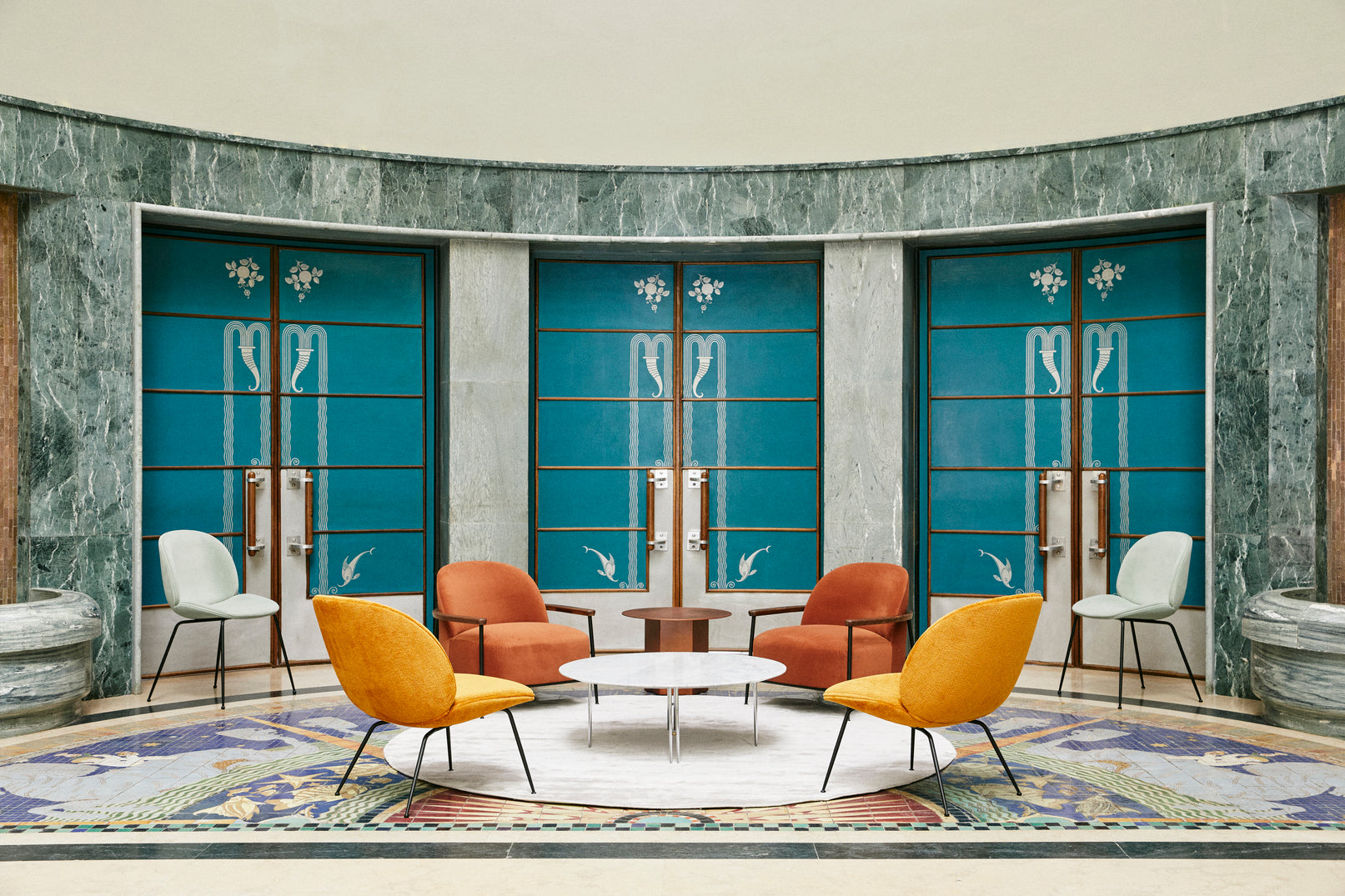 BEETLE upholstered armchair with brass base