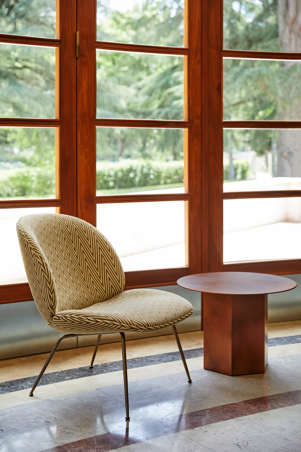 BEETLE upholstered armchair with brass base