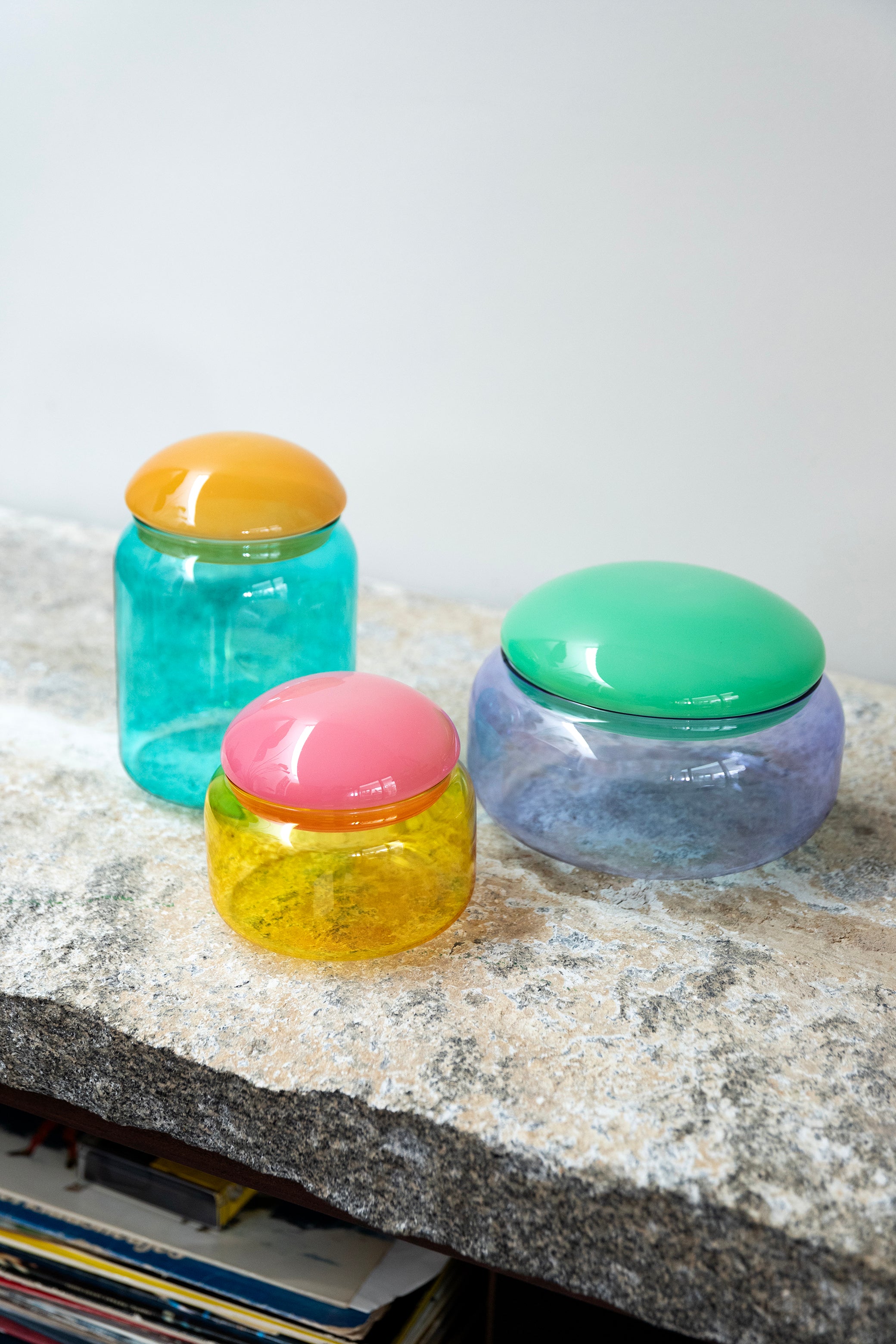 Turquoise glass container PUFFY with an orange lid