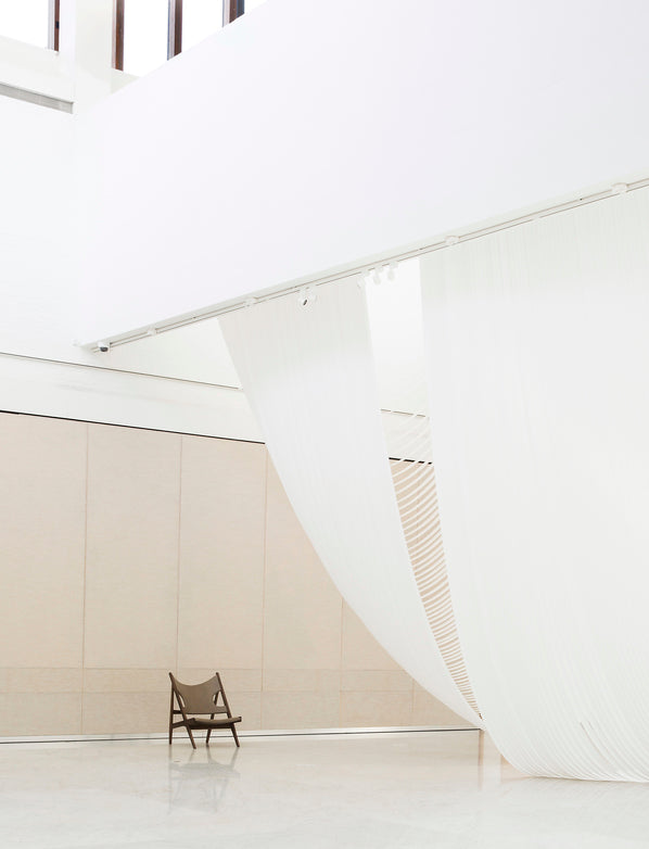 KNITTING armchair in cognac leather with oak base