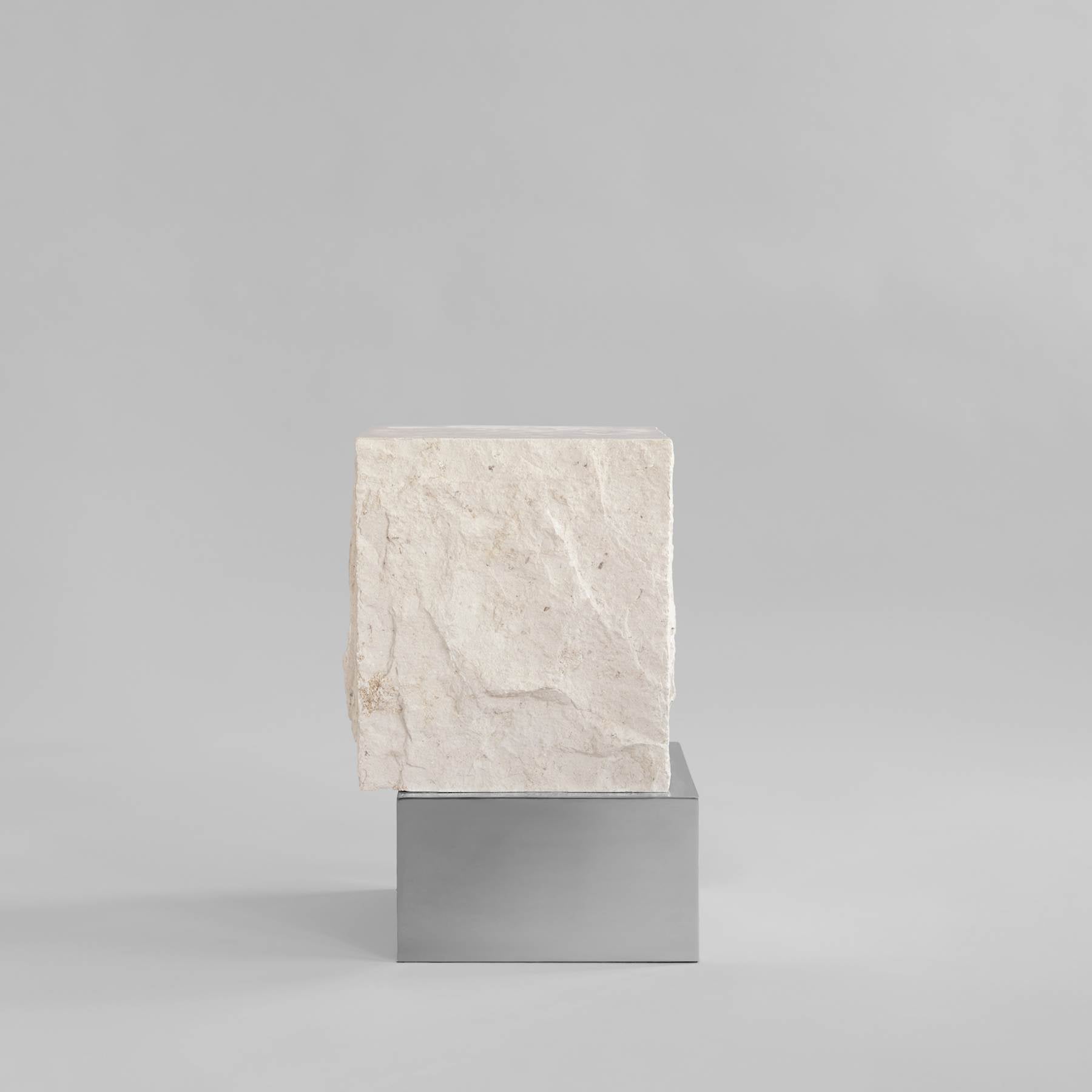 TEMPLE limestone coffee table with a silver base