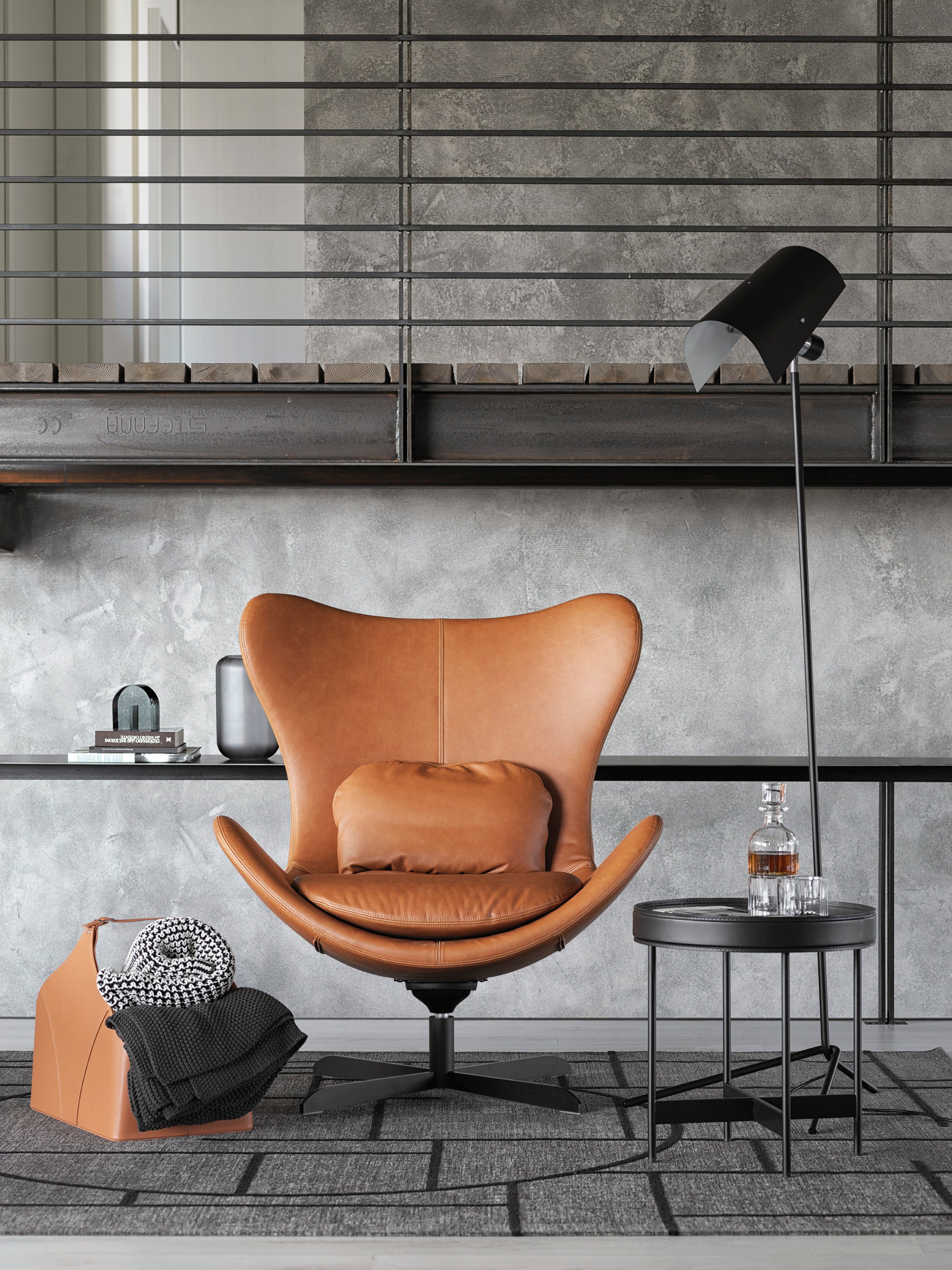 LAZY upholstered swivel armchair with a black metal base