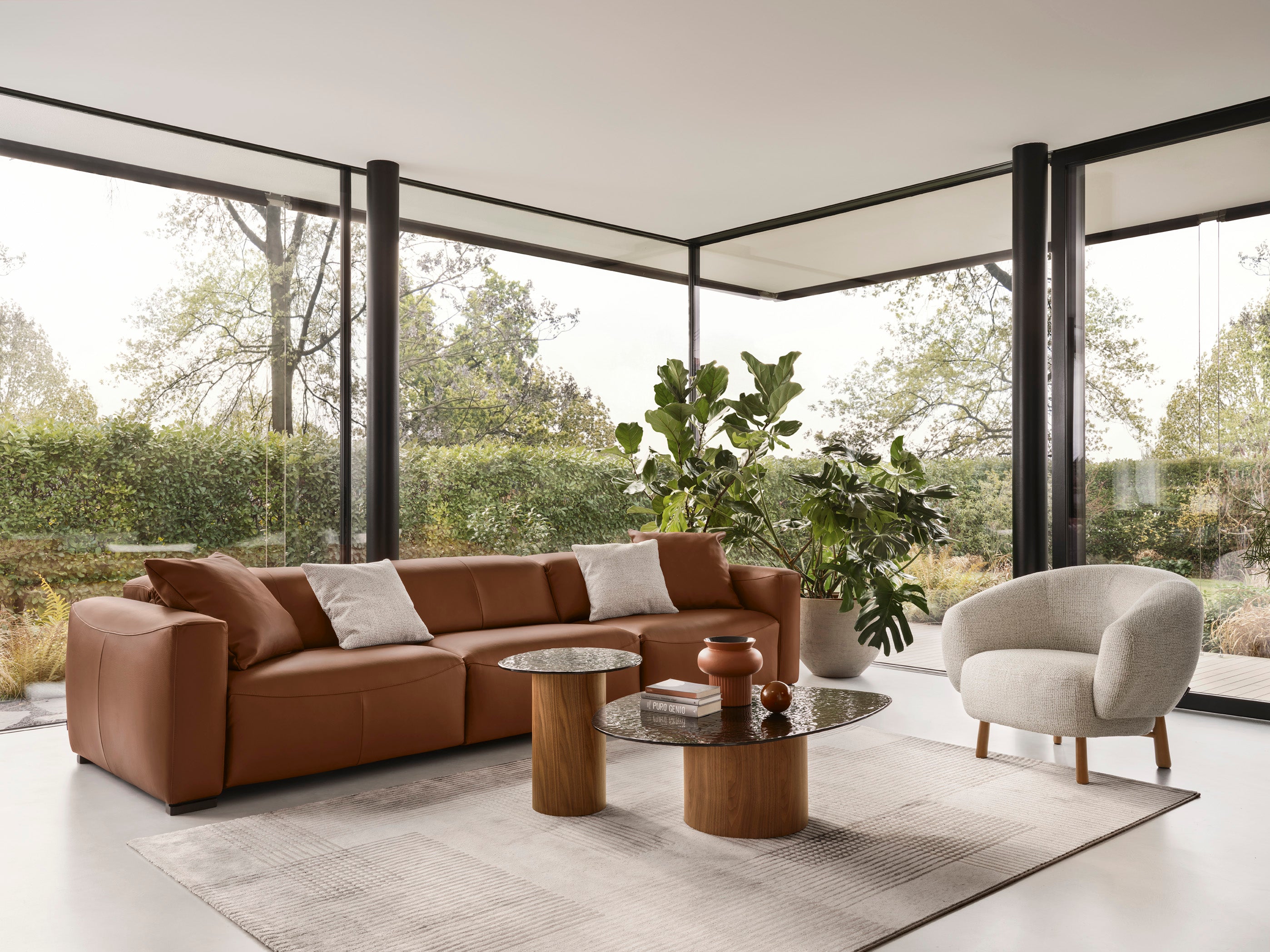 Upholstered RIO armchair with a dark wooden base