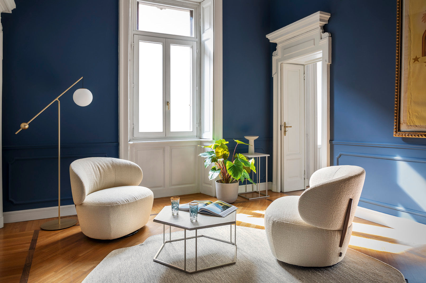 Upholstered swivel armchair MARA