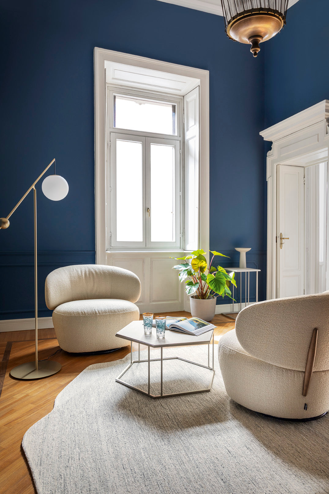 Upholstered swivel armchair MARA