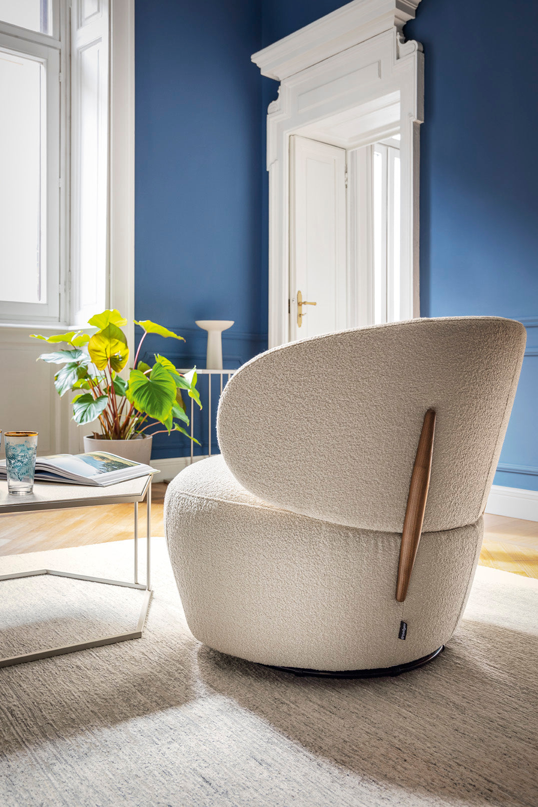 Upholstered swivel armchair MARA