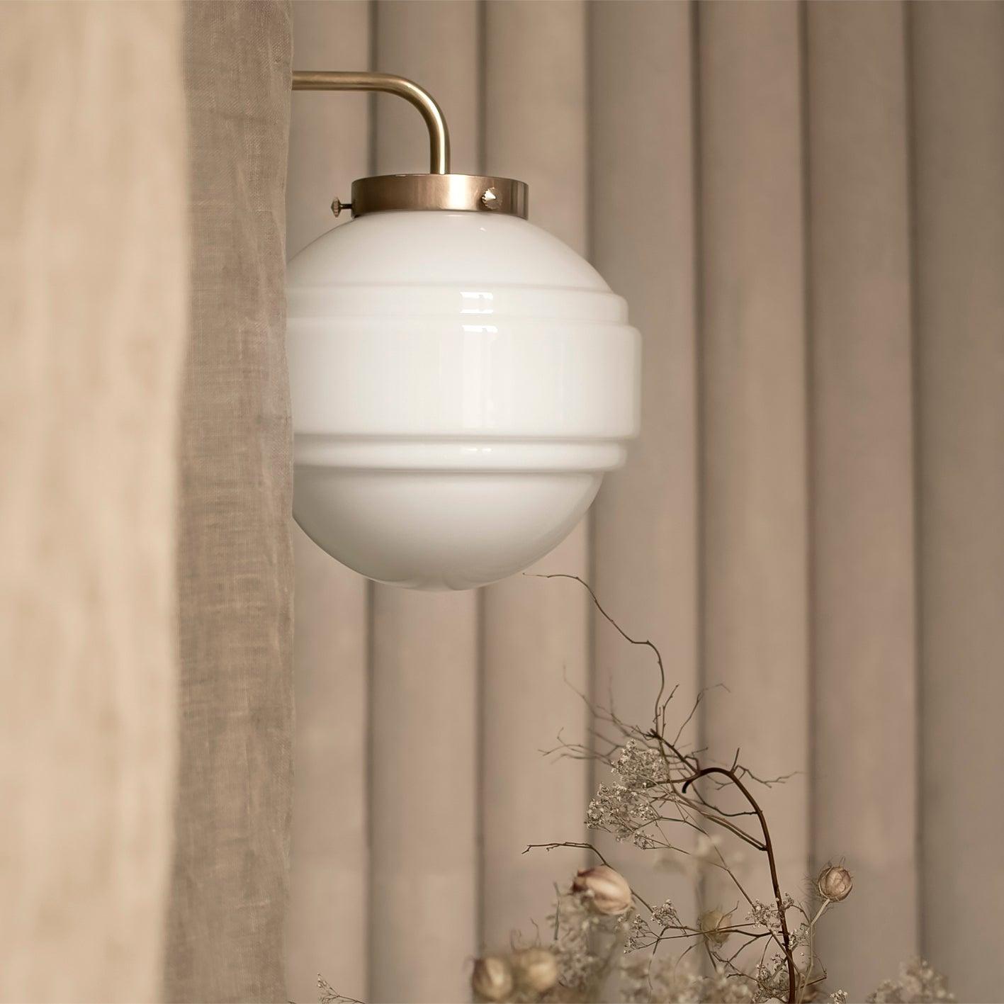 Kinkiet SATURN mosiężny – styl minimalistyczny