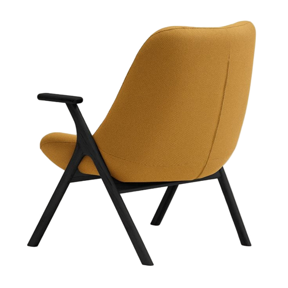 DINS mustard armchair with a black wooden base