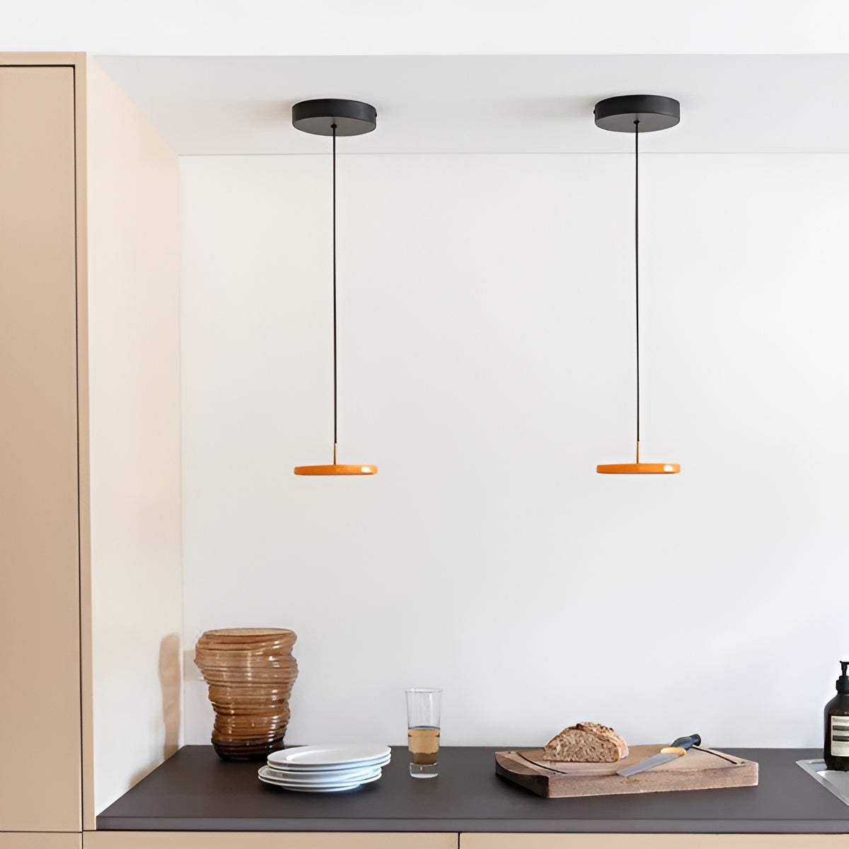 ASTERIA MICRO pendant lamp in orange with a gold accent