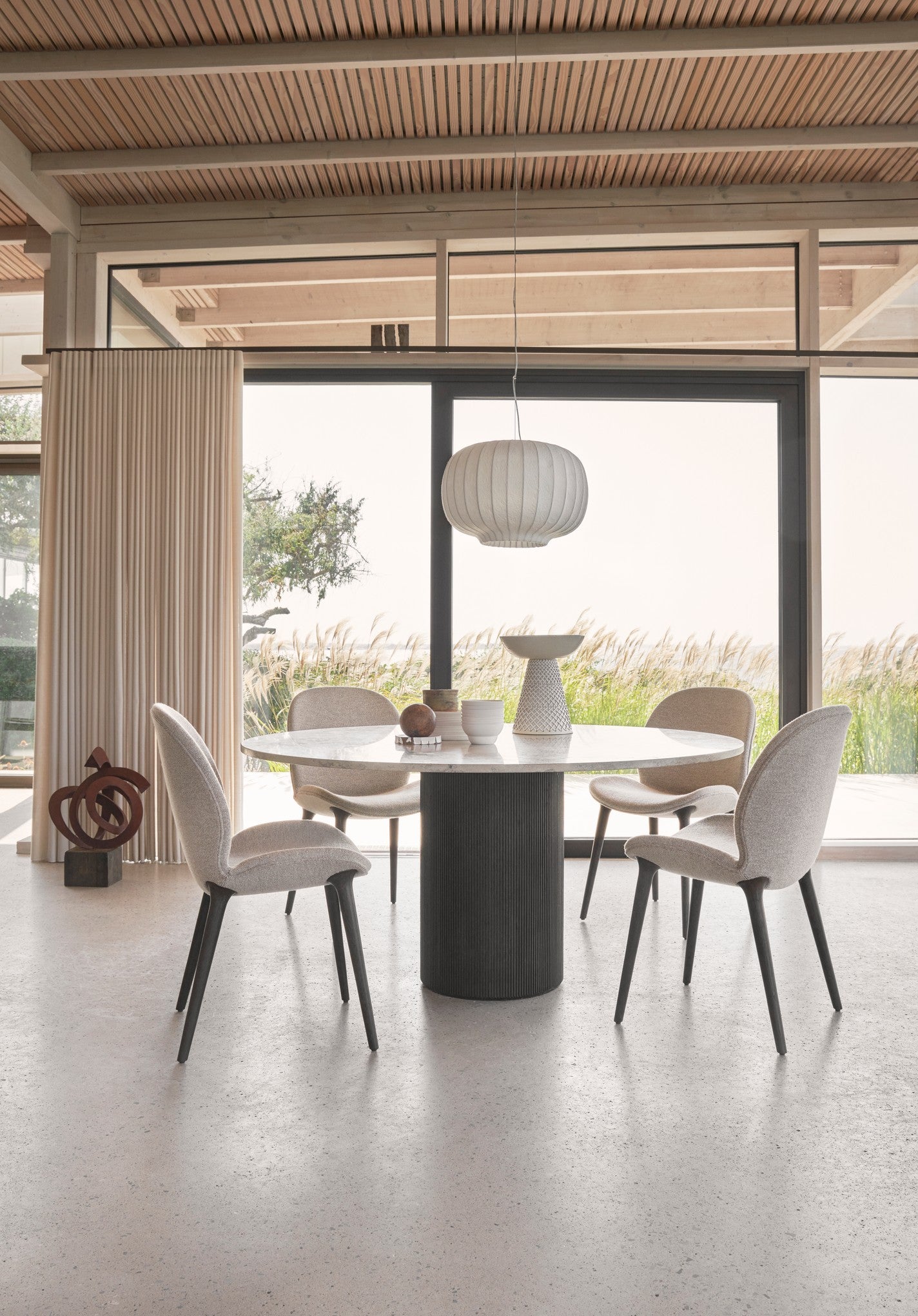 Round Table CABIN with a gray limestone top and a dark oak base