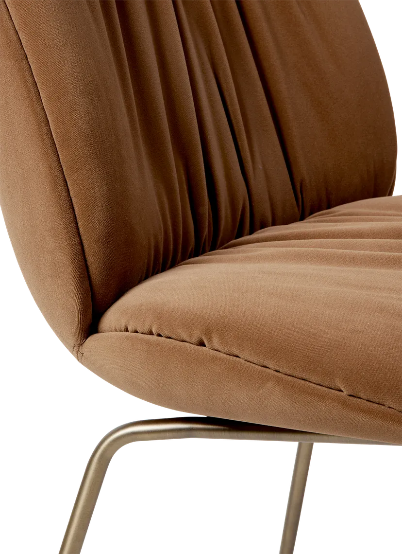 BEETLE SOFT upholstered chair with a brass base