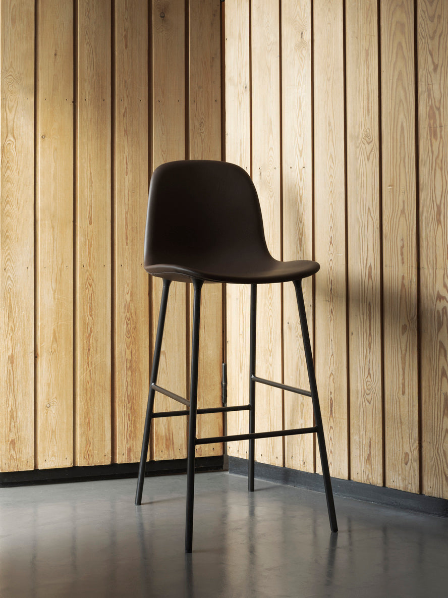 Bar chair upholstered forms with a brown base