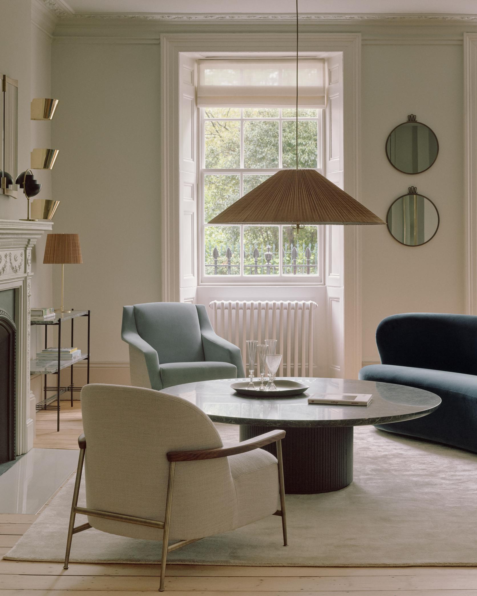 SEJOUR upholstered armchair with black base