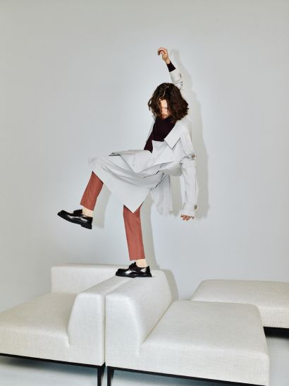 Open right-sided modular corner sofa HOLDEN upholstered with a black base