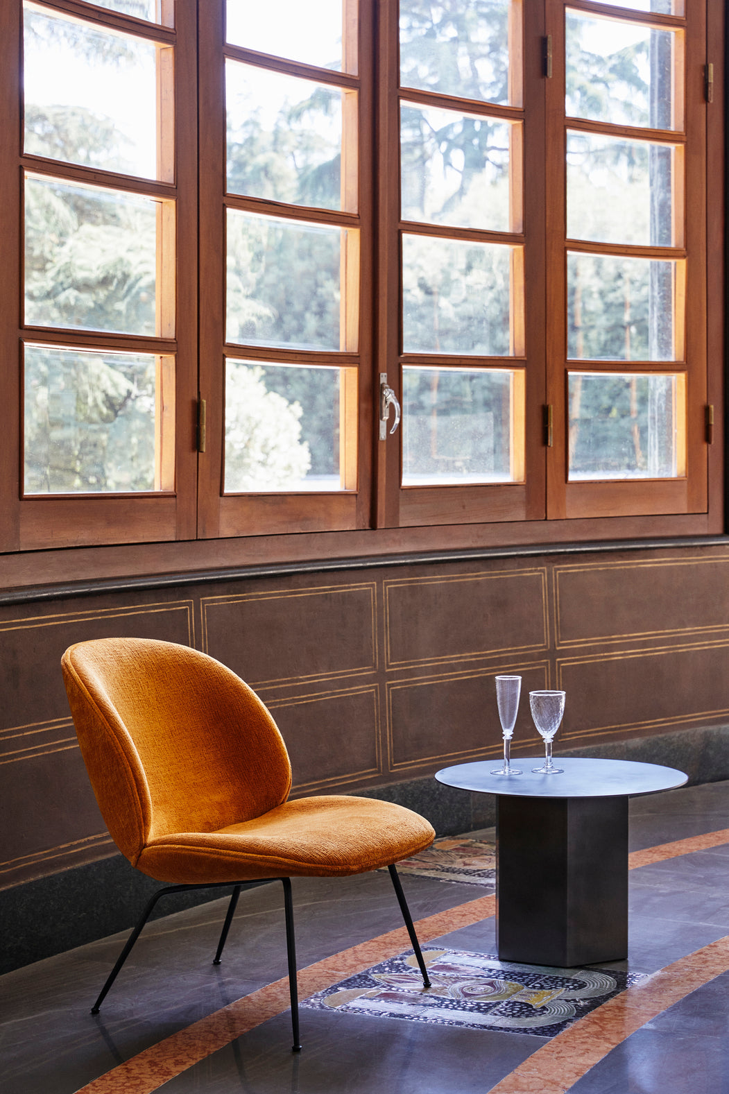 BEETLE upholstered armchair with brass base