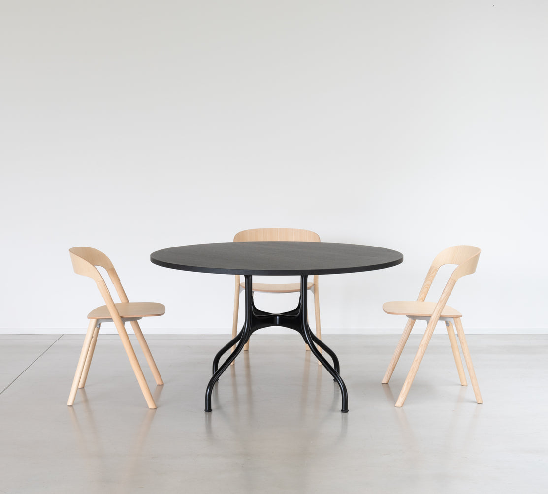 Round table MILA with a black steel base