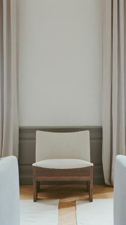 Tenon upholstered armchair with a dark oak base