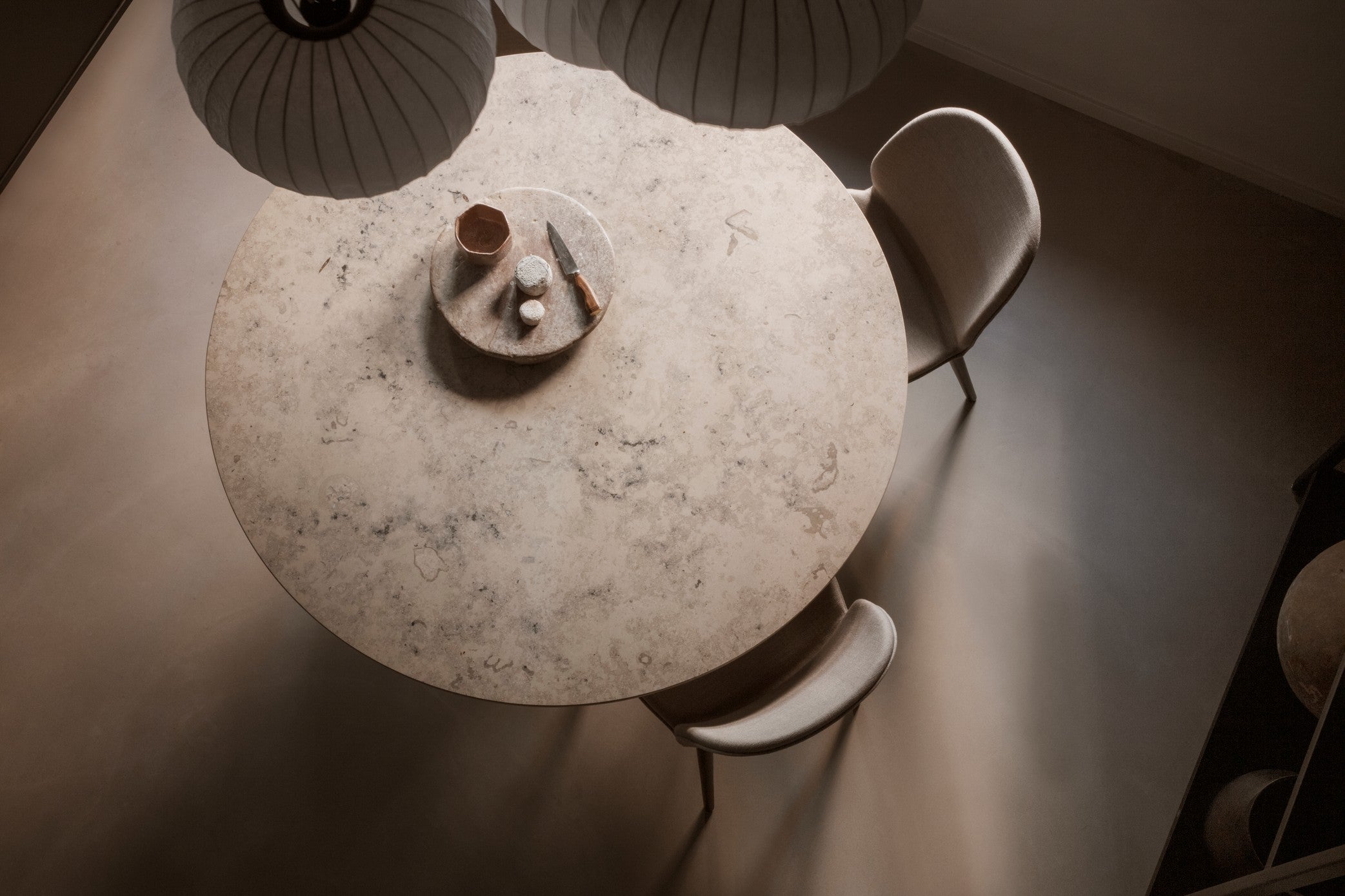 Round Table CABIN with a light oak base and a gray limestone top