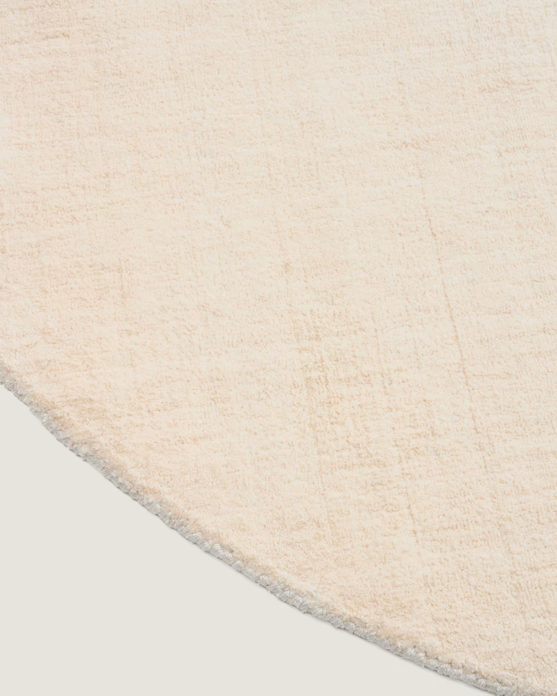 Beige round rug EMPURIES