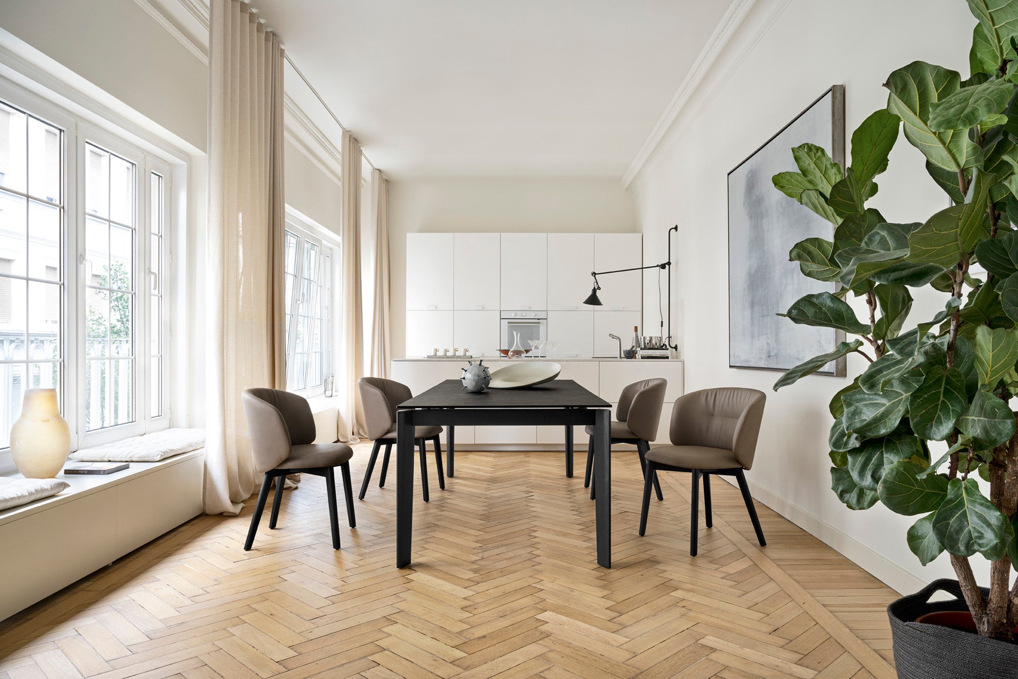 Upholstered SWEEL chair with a dark wooden base