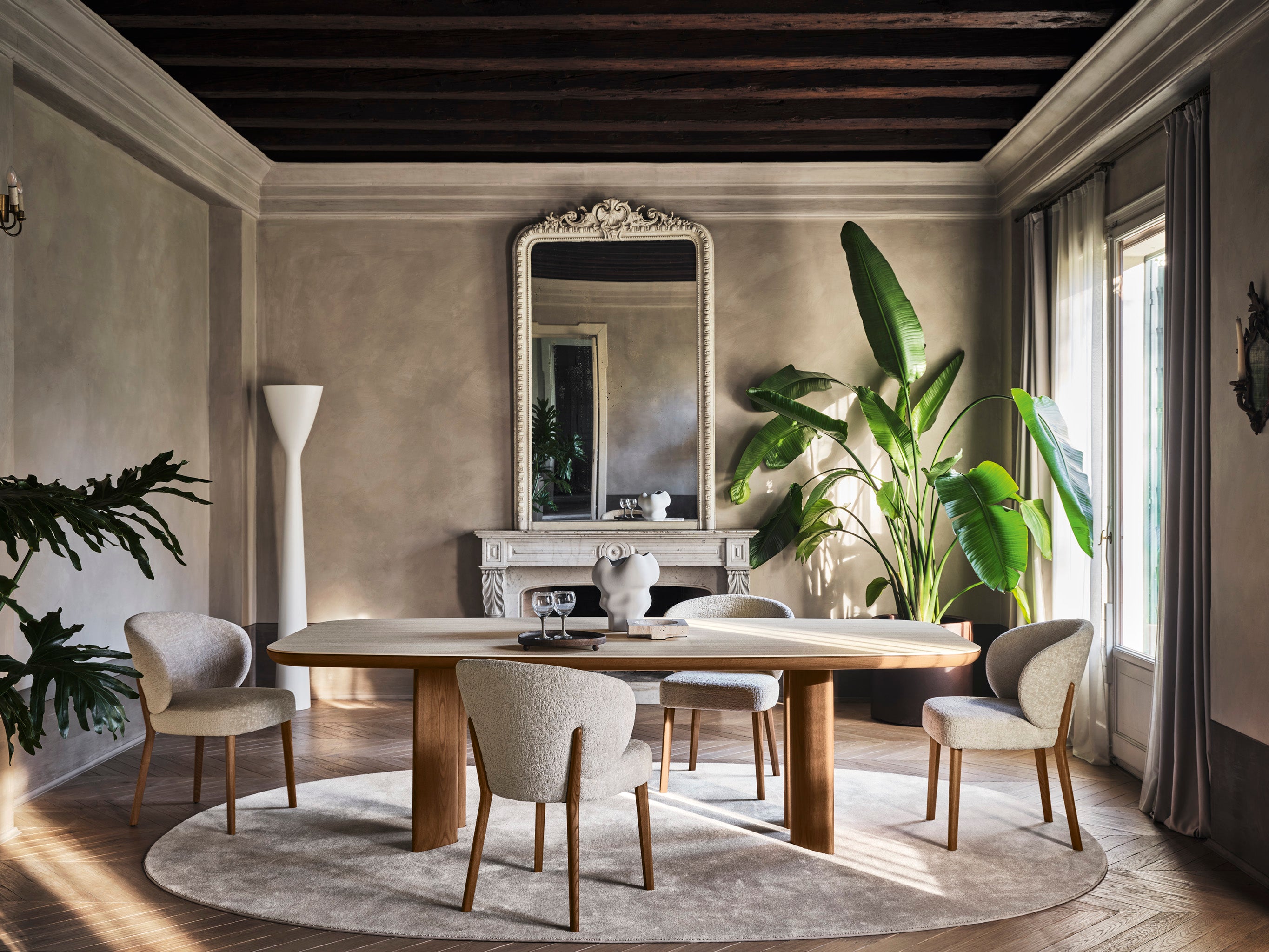 MARA upholstered chair with a black wooden base