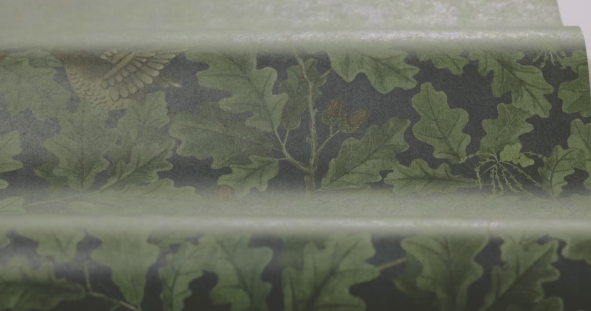 Wallpaper with a leafy plant motif IN THE OAK navy blue with green