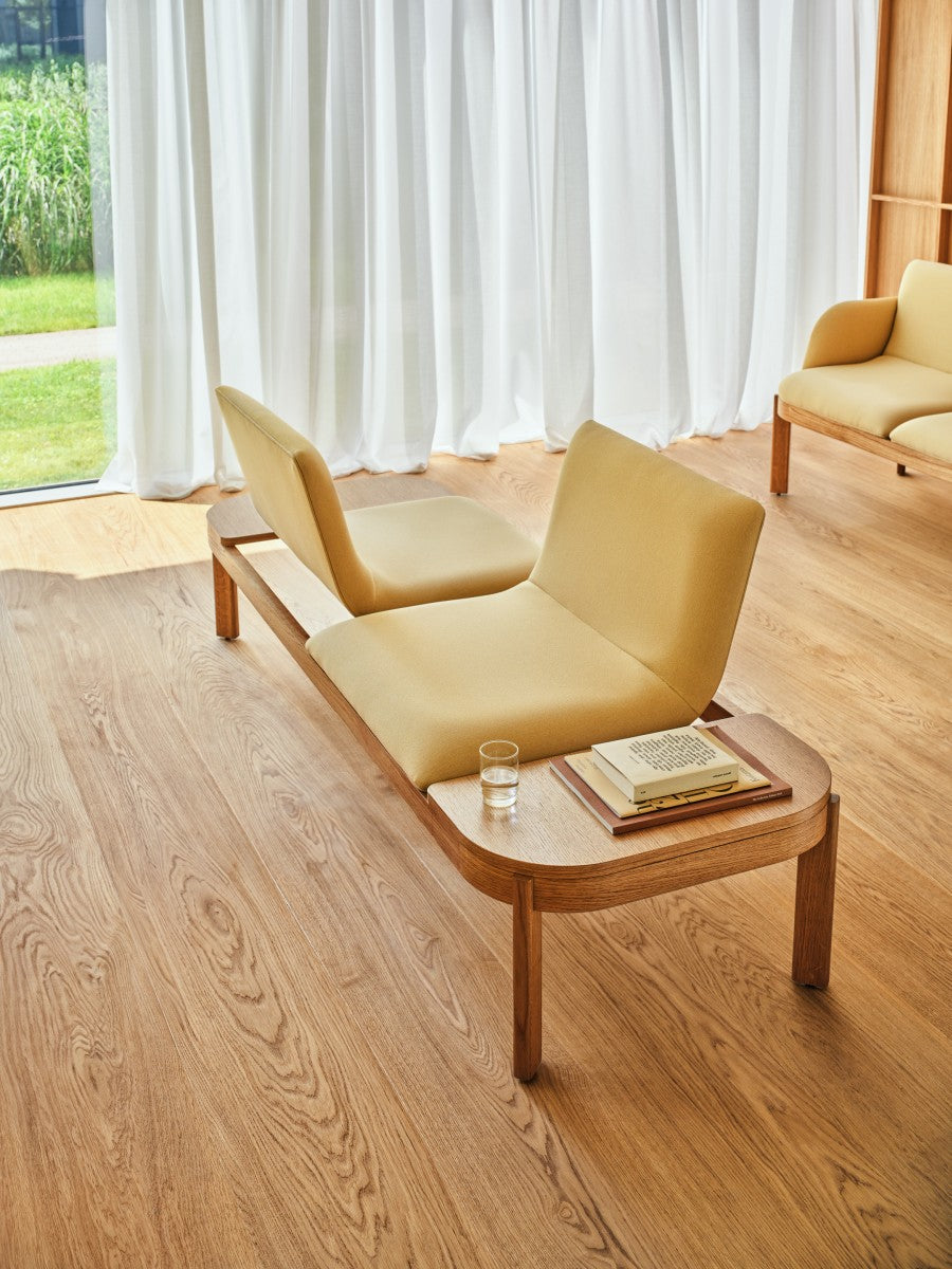 Upholstered bench with ramps of the wooden base